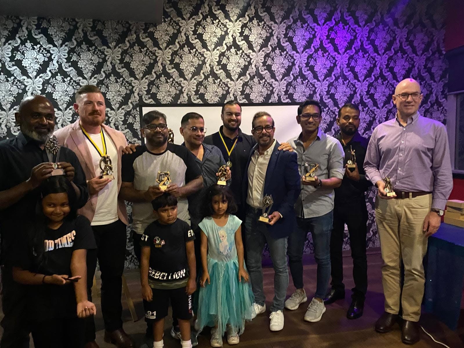 Club award recipients holding trophies